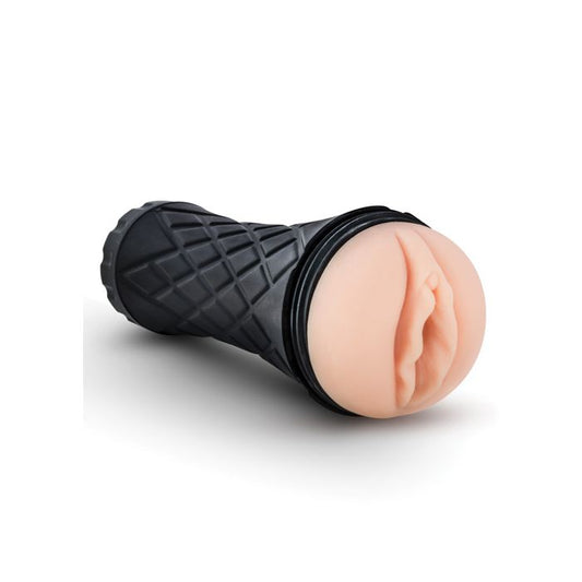 Close-up of Blush M For Men Torch Pussy Vanilla fleshlight lying on its side – lifelike adult toy.