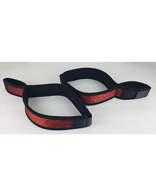 Spartacus bondage wrist to thigh cuffs with neoprene comfort and adjustable red straps for secure restraint play